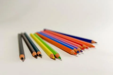 Multiple colored pencils on a white background. Stock Photos