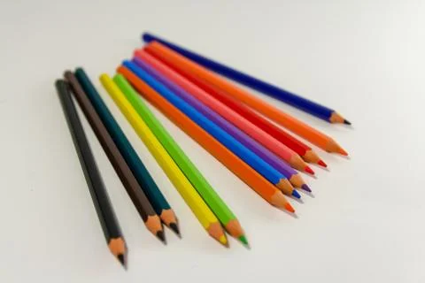 Multiple colored pencils on a white background. Stock Photos
