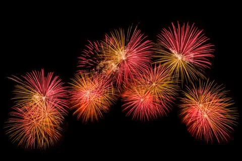 Multiple Colorful Firework Bursts Illuminating The Night Sky Wide Shot Stock-Fotos