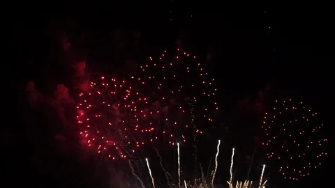 Multiple colorful fireworks explode filling the screen with the grand Stock Footage 121262013