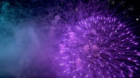 Multiple colorful fireworks exploding in the sky of Fukuoka city. Closeup. Stock Footage 78334816