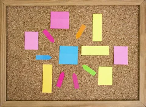 Multiple colorful paper posts, empty backdrop on cork board background, bra.. Stock Photos