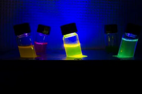 Multiple colourful light induced catalyst photochemical reaction side view in Stock Photos