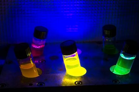 Multiple colourful light induced catalyst photochemical reaction in glass via Stock Photos