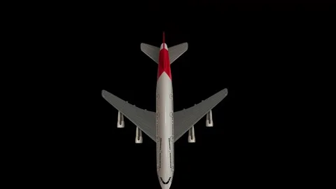 Multiple Commercial Airplanes Falling Downward Against a Solid Black Background Stock Footage 346372164