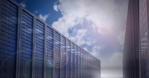 Multiple computer servers over blue sky background, data processing and Stock Photos