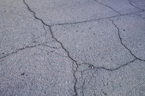 Multiple cracks on asphalt Stock Photos