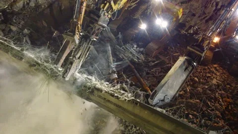 Multiple Crews Working To Demolish An Old Building At Night Using Stock Footage 252056011