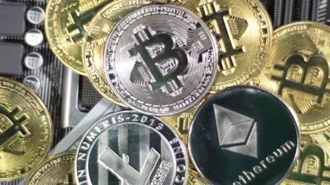 Multiple crypto currencies: Litecoin LTC, Ethereum ETH and Bitcoins BTC on Stock Footage 194504165