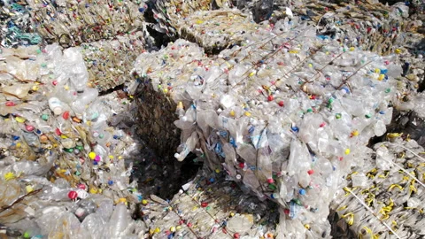 Multiple cubes of compressed transparent plastic garbage at waste recycling Stock-Footage 247315948