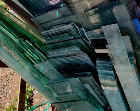 Multiple cut glass sheets outside a glassworks shop Stock Photos