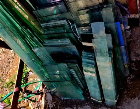 Multiple cut glass sheets outside a glassworks shop Stock Photos