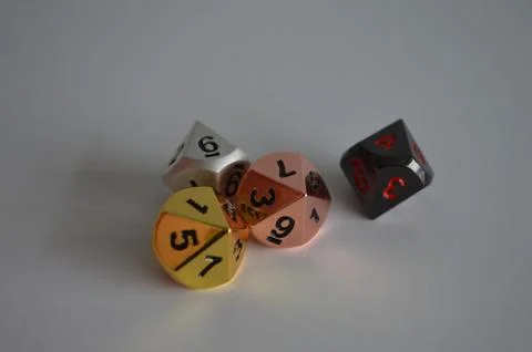 Multiple d10 ten sided dice die copper silver gold black Foto stock