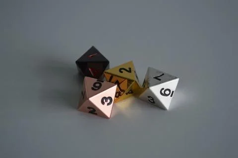Multiple d8 eight sided dice die copper silver gold black Foto stock