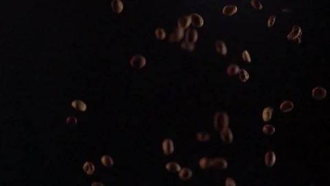 Multiple dark brown coffee beans falling down Video stock 94461153