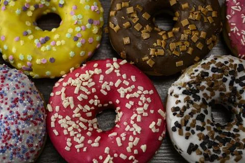 Multiple delicious donuts on table close up shot Stock Photos