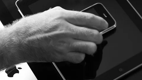 Multiple devices from Apple Computer stack one above another Stock Footage 107783829