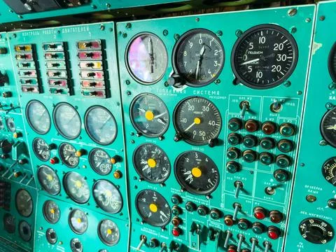 Multiple dials, switches, and gauges are visible on a control panel inside a  库存照片