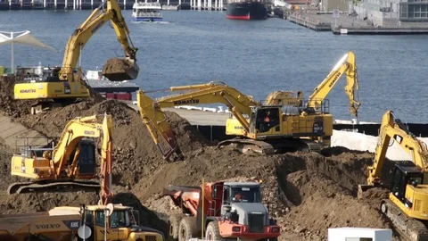 Multiple diggers on a construction site Stock Footage 82064019