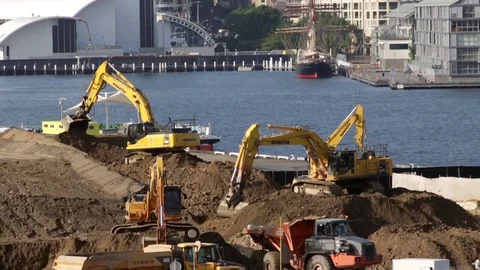 Multiple diggers work on a construction site Stock Footage 82063377