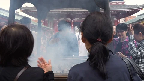 Multiple Diverse People Praying At Buddhist Temple - Incense Smoke - Senso Ji Stock Footage 98176303