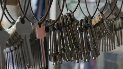 Multiple Duplicate Keys Hanging at Locksmith Shop Stock Footage 318213842
