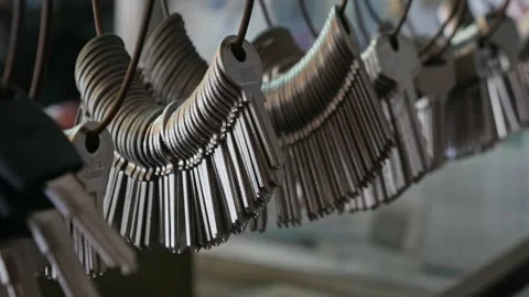 Multiple Duplicate Keys Hanging at Locksmith Shop Stock Footage 318639389