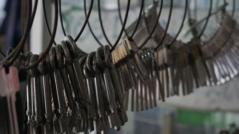 Multiple Duplicate Keys Hanging at Locksmith Shop Stock Footage 319522569