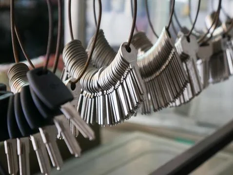 Multiple Duplicate Keys Hanging on Wire Rings at Locksmith Shop - Key Cutti.. Stock Photos