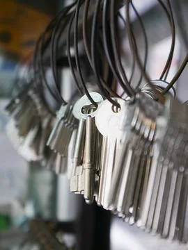Multiple Duplicate Keys Hanging on Wire Rings at Locksmith Shop - Key Cutti.. Stock Photos