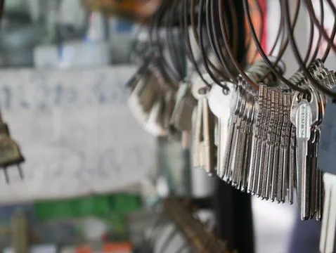 Multiple Duplicate Keys Hanging on Wire Rings at Locksmith Shop - Key Cutti.. Stock Photos