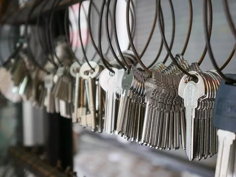 Multiple Duplicate Keys Hanging on Wire Rings at Locksmith Shop - Key Cutti.. Stock Photos