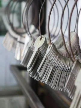 Multiple Duplicate Keys Hanging on Wire Rings at Locksmith Shop - Key Cutti.. Stock Photos