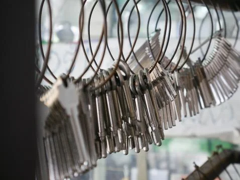 Multiple Duplicate Keys Hanging on Wire Rings at Locksmith Shop - Key Cutti.. Stock Photos
