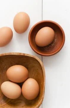 Multiple eggs in different bowls Stock Photos