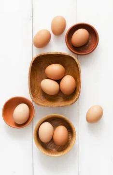 Multiple eggs in different bowls Stock Photos