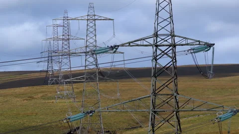 Multiple Electricity Transmission Pylons Stretching Across the Remote Rishworth Stock-Footage 316368252