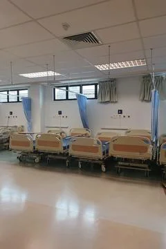 A multiple empty hospital beds 库存照片