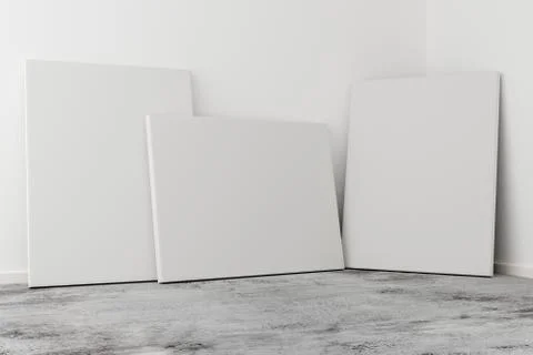 Multiple empty picture frames canvases leaning against white wall in bright r Stock Illustration