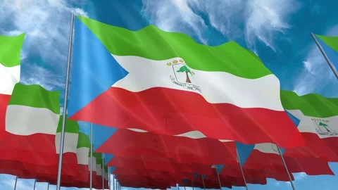 Multiple Equatorial Guinea flags seamless looping waving on blue sky Stock Footage 343679670