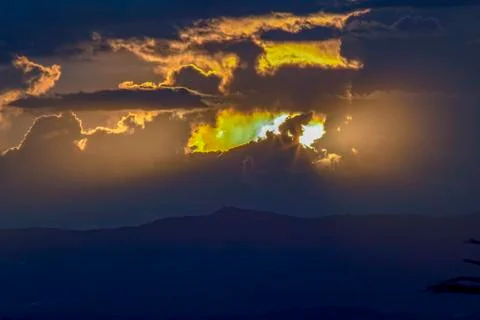 Multiple exposure of the almost dark end of a sunset over the central Andean  Stock Photos