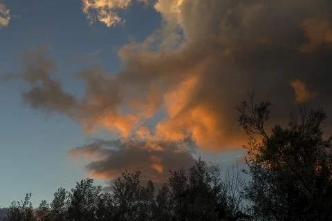 Multiple exposure composite of a dense cumulus cloud with the colors of the a Stock Photos