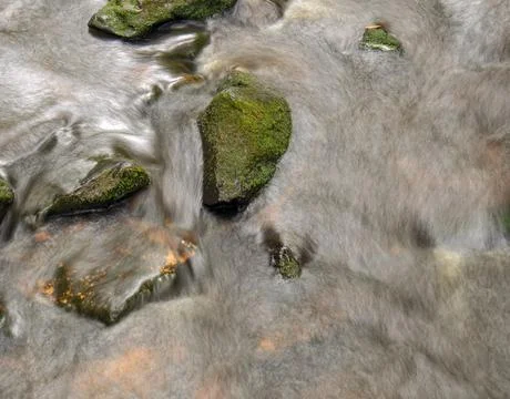 Multiple exposure composite from the top of the stream and rocks of a river i Stock Photos