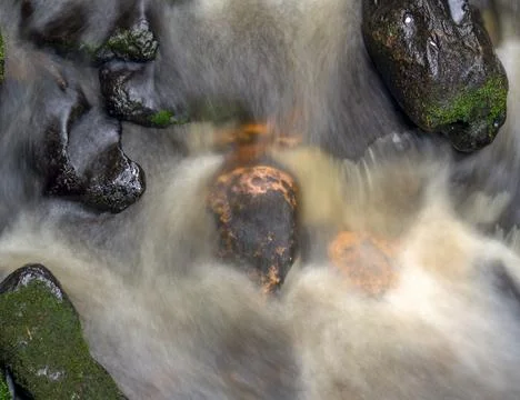 Multiple exposure composite from the top of the stream and rocks of a river i Stock Photos
