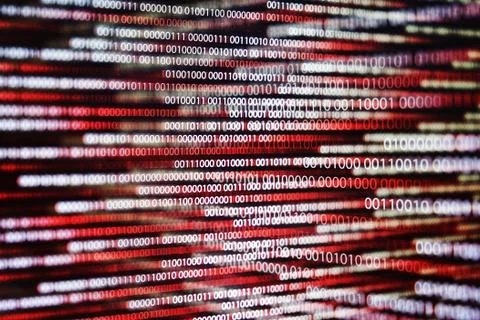 Multiple exposure red binary code lines. error and computer problems concepts Stock Photos