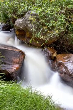 Multiple exposure of a thin waterfall runing down at an Andean mountain in ce Stock Photos