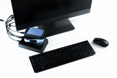 Multiple external hard drives connected to a monoblock on a white background Stock Photos