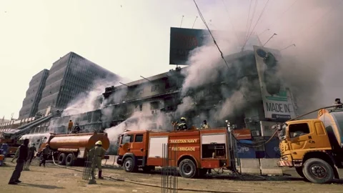Multiple fire trucks assembled near the Gul Plaza Mall due to fire inside the 스톡 동영상 327767141