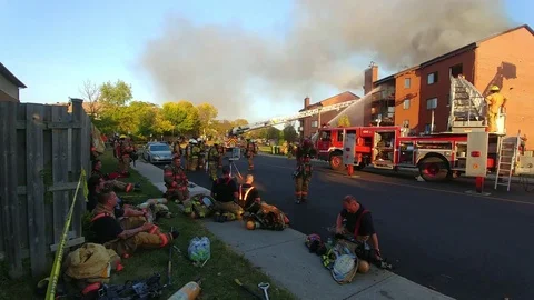 Multiple Firefighters Resting While Other Crews Takeover At Fire Stock Footage 82222583