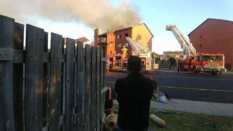 Multiple Firefighters Resting While Other Crews Takeover At Fire - 24fps 1080p Stock Footage 91904409